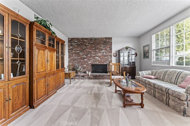 living room featuring a brick fireplace, a textured ceiling, and light colored carpet