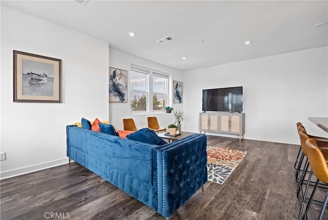 living room featuring dark wood-type flooring