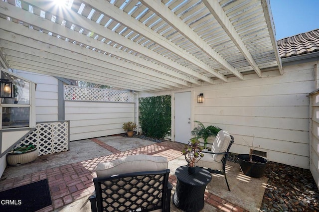 view of patio featuring a pergola