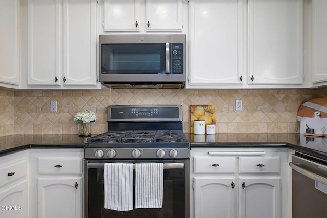 kitchen featuring tasteful backsplash, appliances with stainless steel finishes, and white cabinets