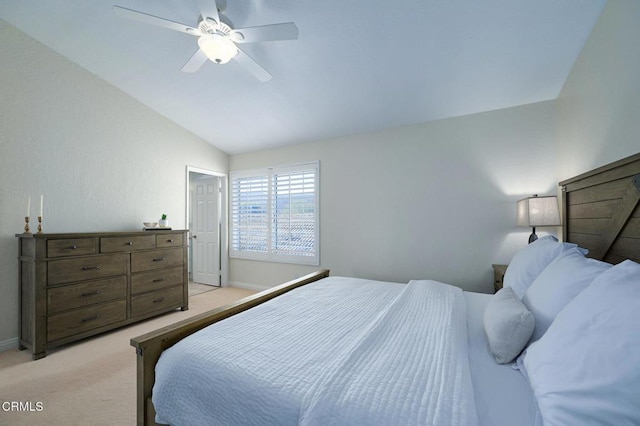 bedroom featuring lofted ceiling, light carpet, and ceiling fan