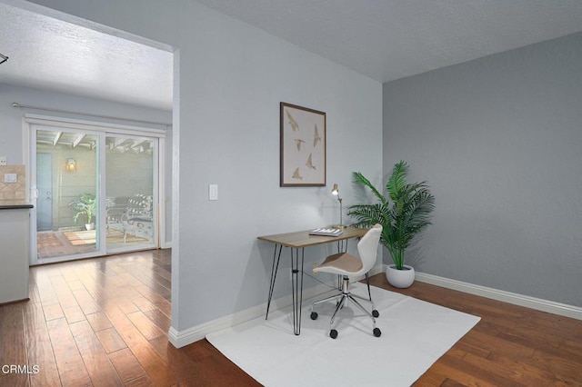 office with dark hardwood / wood-style floors