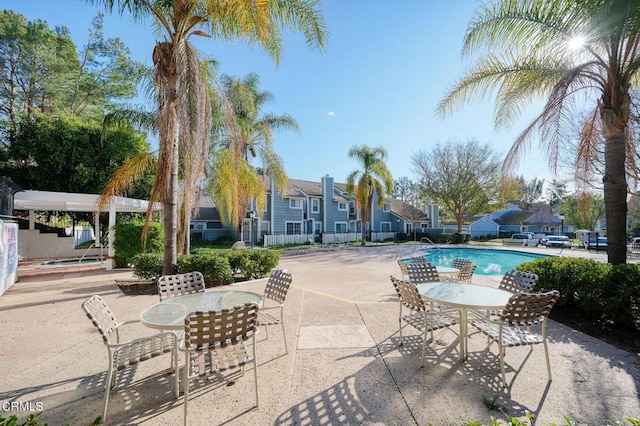 view of swimming pool featuring a patio area