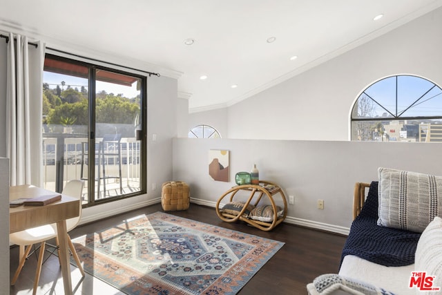 living area with dark hardwood / wood-style flooring and ornamental molding