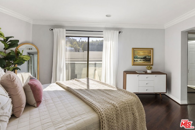 bedroom with crown molding and hardwood / wood-style flooring