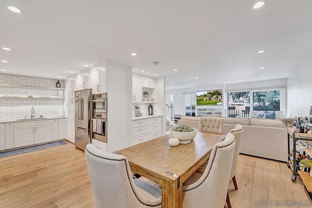 dining area featuring sink and light hardwood / wood-style floors