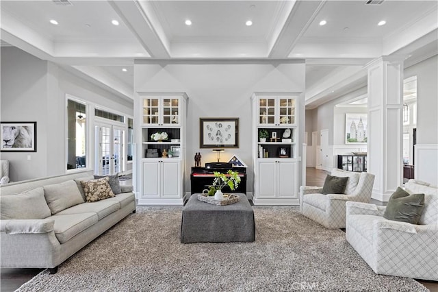 living room with french doors, crown molding, built in features, beam ceiling, and decorative columns