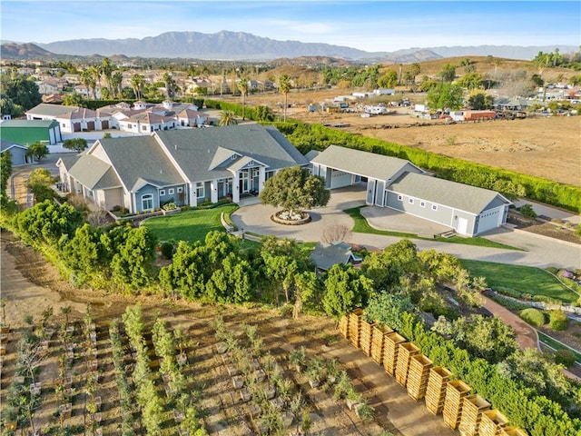 birds eye view of property featuring a mountain view