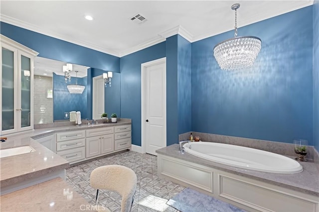 bathroom featuring ornamental molding, vanity, a chandelier, and a tub