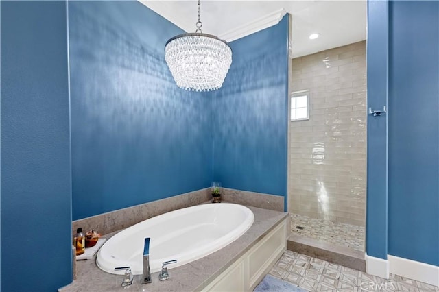 bathroom featuring an inviting chandelier and separate shower and tub