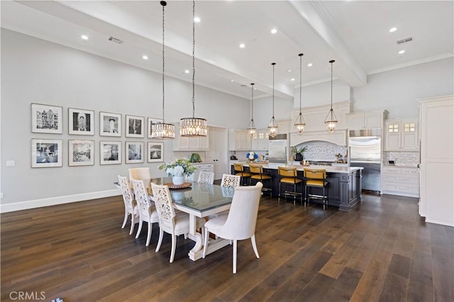 dining area with ornamental molding, dark hardwood / wood-style flooring, a notable chandelier, a towering ceiling, and beam ceiling