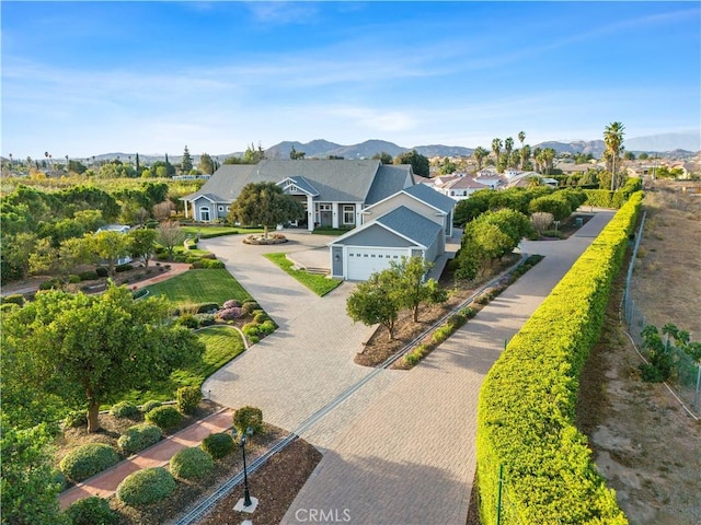 birds eye view of property with a mountain view