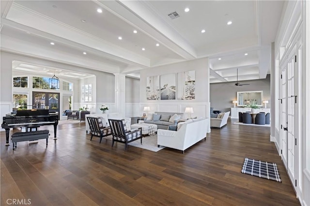 living room with an inviting chandelier, dark wood-type flooring, french doors, and beamed ceiling