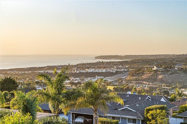 aerial view at dusk with a water view