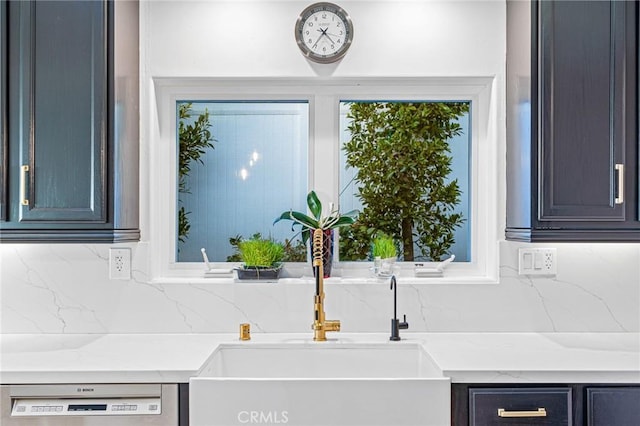 kitchen with sink, dishwashing machine, and decorative backsplash