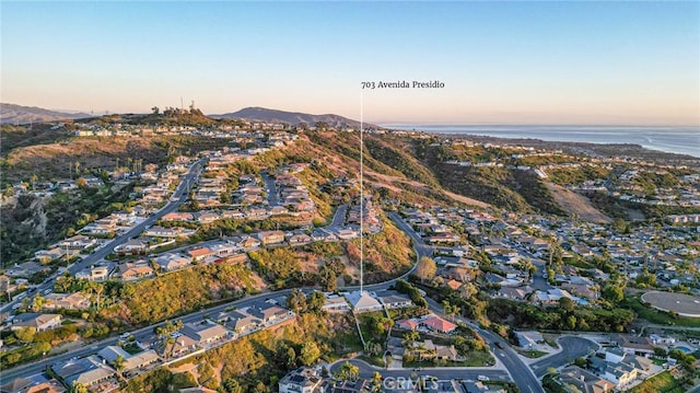 aerial view at dusk with a water view