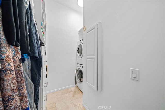 washroom with stacked washer and dryer