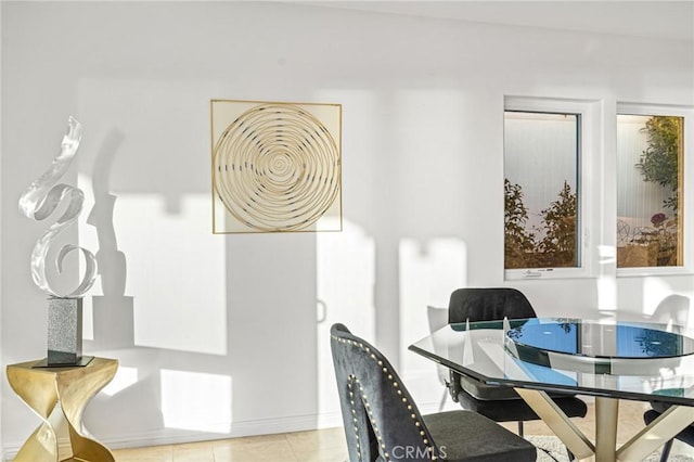 dining space featuring light tile patterned flooring