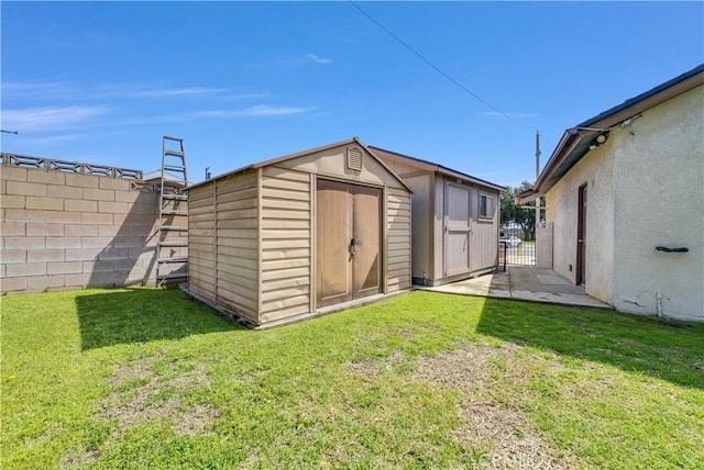 view of shed with a fenced backyard