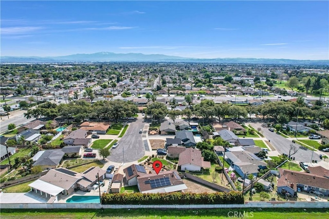 drone / aerial view featuring a mountain view and a residential view