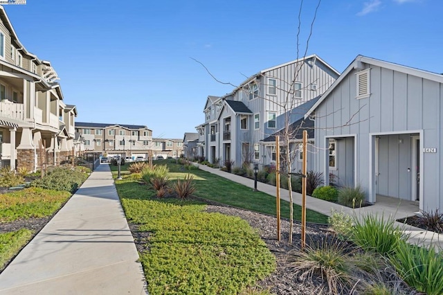 view of property's community with a yard