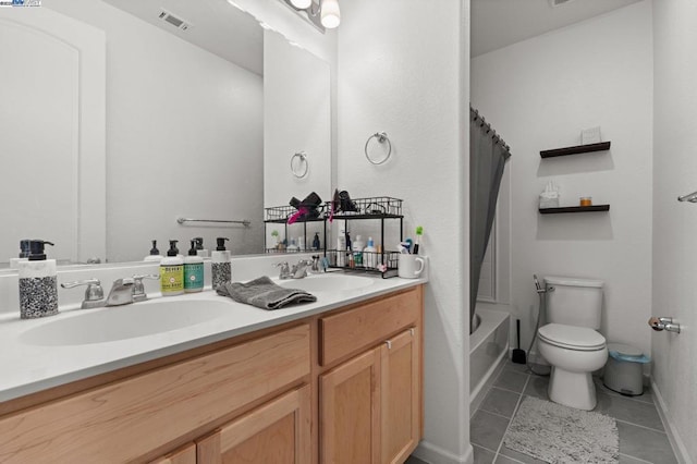 full bathroom featuring toilet, vanity, tile patterned floors, and shower / tub combo with curtain