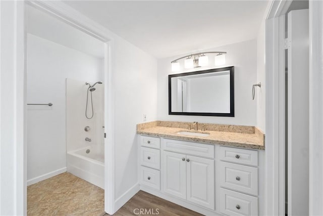 bathroom featuring bathing tub / shower combination and vanity