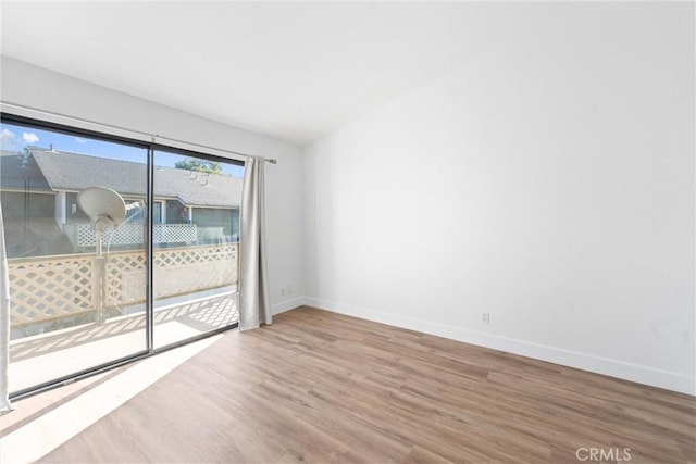 empty room with hardwood / wood-style flooring