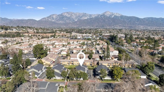 birds eye view of property with a mountain view