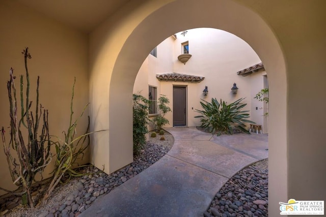 property entrance featuring a patio area