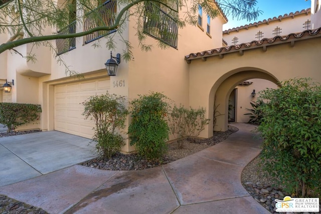 view of side of property featuring a garage