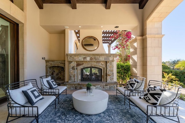 view of patio / terrace featuring french doors and an outdoor stone fireplace