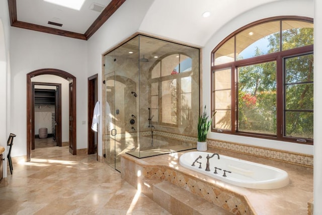 bathroom featuring crown molding and plus walk in shower