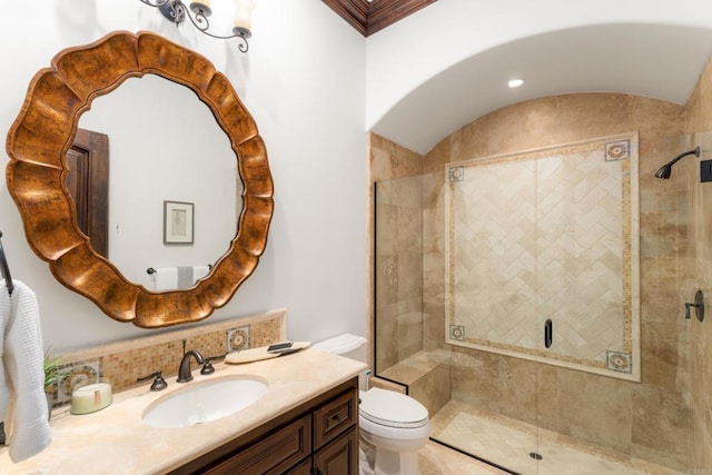 bathroom with vanity, toilet, and an enclosed shower