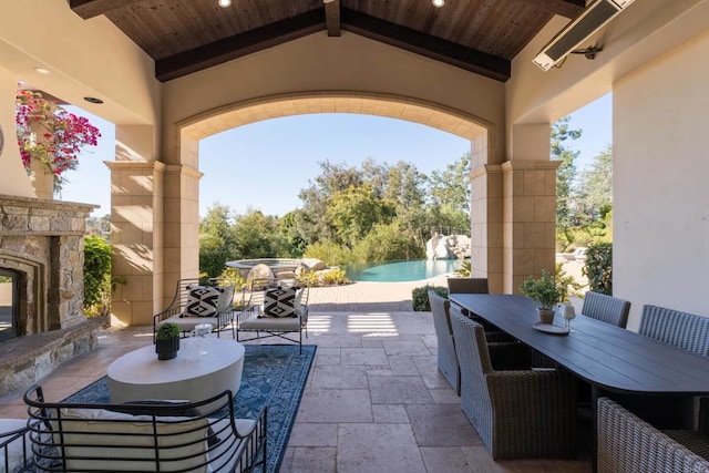 view of patio / terrace with an outdoor stone fireplace