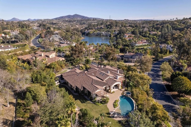 bird's eye view with a water and mountain view