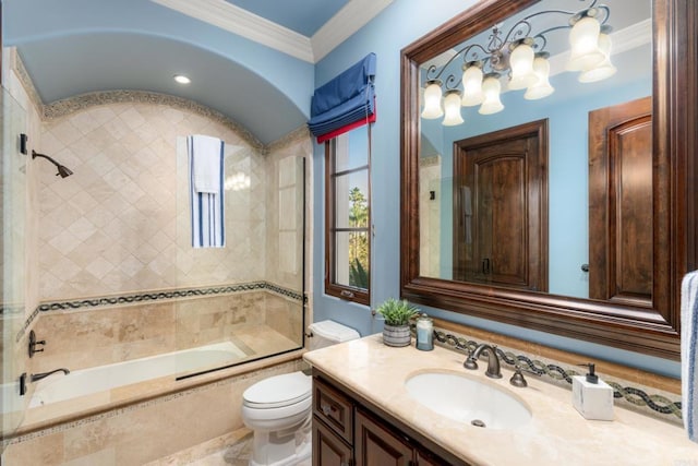 full bathroom with tiled shower / bath, vanity, toilet, and ornamental molding