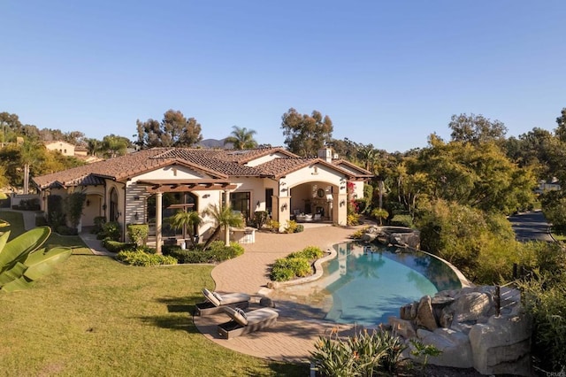 view of pool featuring a lawn and a patio area