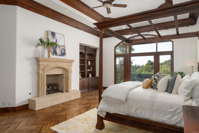 bedroom featuring a tiled fireplace, dark parquet flooring, ornamental molding, and ceiling fan