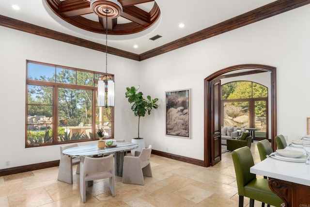 dining space with ornamental molding and coffered ceiling