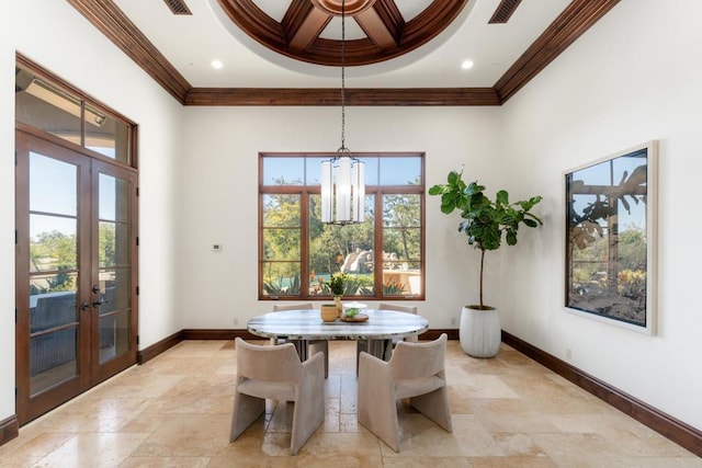 dining area with crown molding, coffered ceiling, breakfast area, and french doors