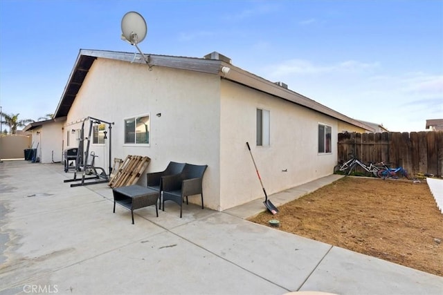 rear view of property featuring a patio area