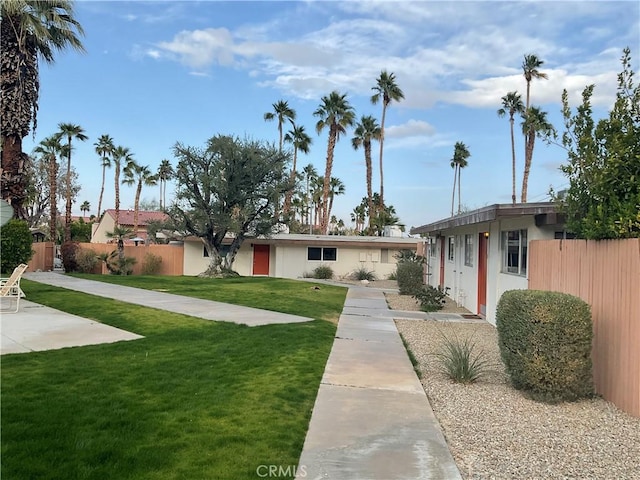 single story home featuring a patio area and a front lawn