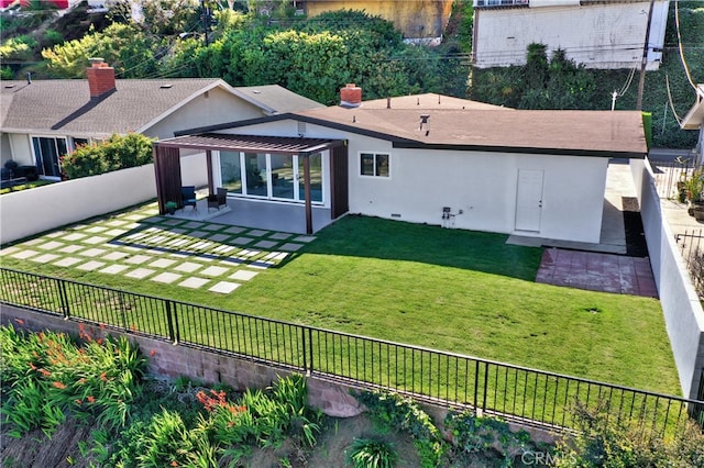 back of house featuring a patio, a lawn, a fenced backyard, and stucco siding