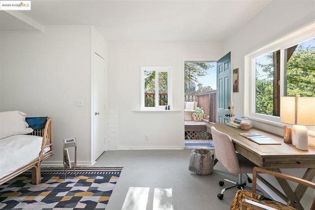 office area with plenty of natural light and concrete floors