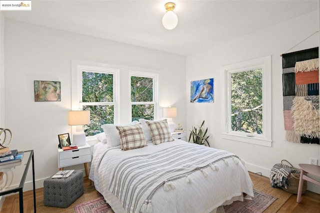 bedroom with hardwood / wood-style flooring