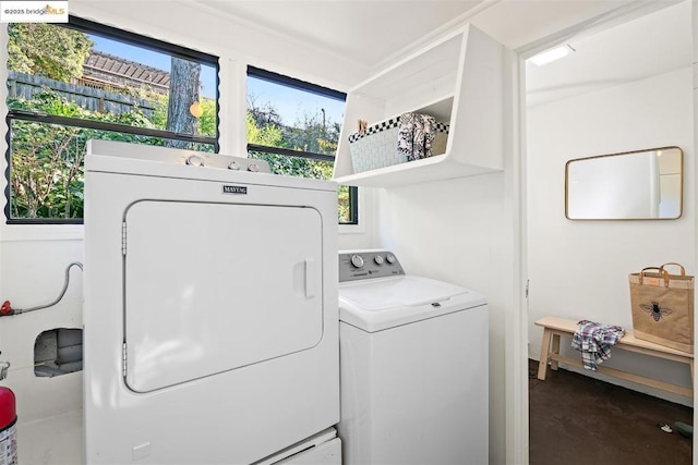 washroom featuring independent washer and dryer