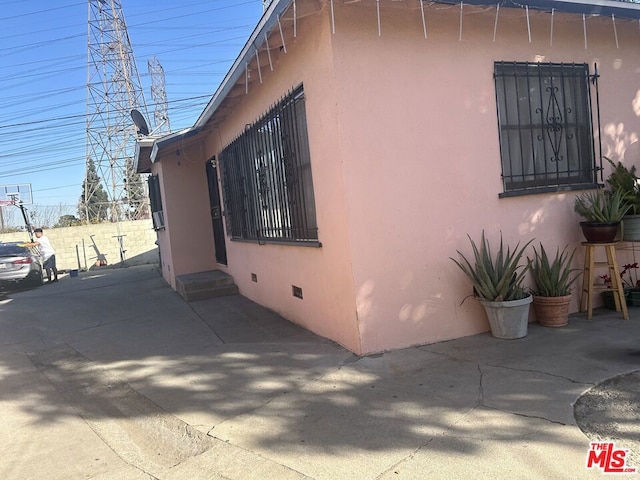 view of side of property featuring a patio