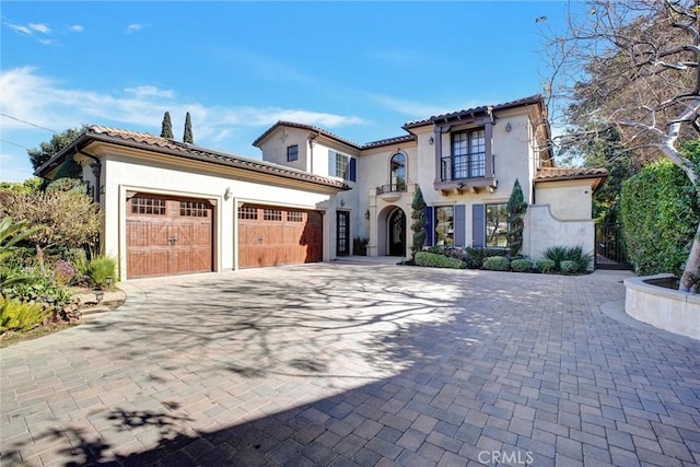 mediterranean / spanish-style home featuring a garage