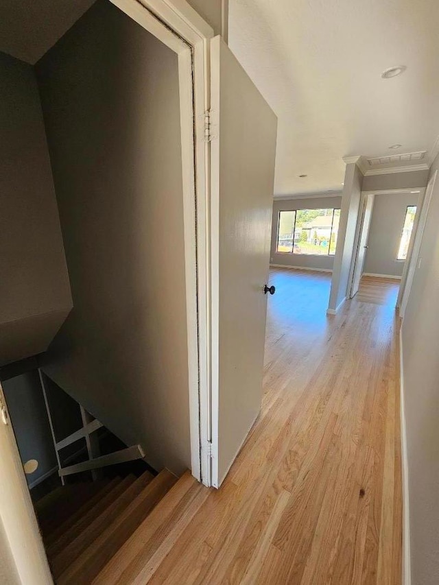 corridor with light hardwood / wood-style floors